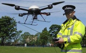 Police aerial surveillance drone...PC Derek Charlton of Merseyside Police operates their new aerial surveillance drone in Liverpool. PRESS ASSOCIATION Photo. Picture date: Monday May 21, 2007. The remote control helicopter, fitted with CCTV cameras, will be used by officers in Merseyside to track criminals and record anti-social behaviour. See PA story POLICE Drone. Photo credit should read: John Giles/PA Wire